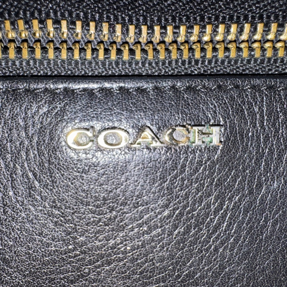 GUC: Coach Black Leather Wristlet with black and white sides!